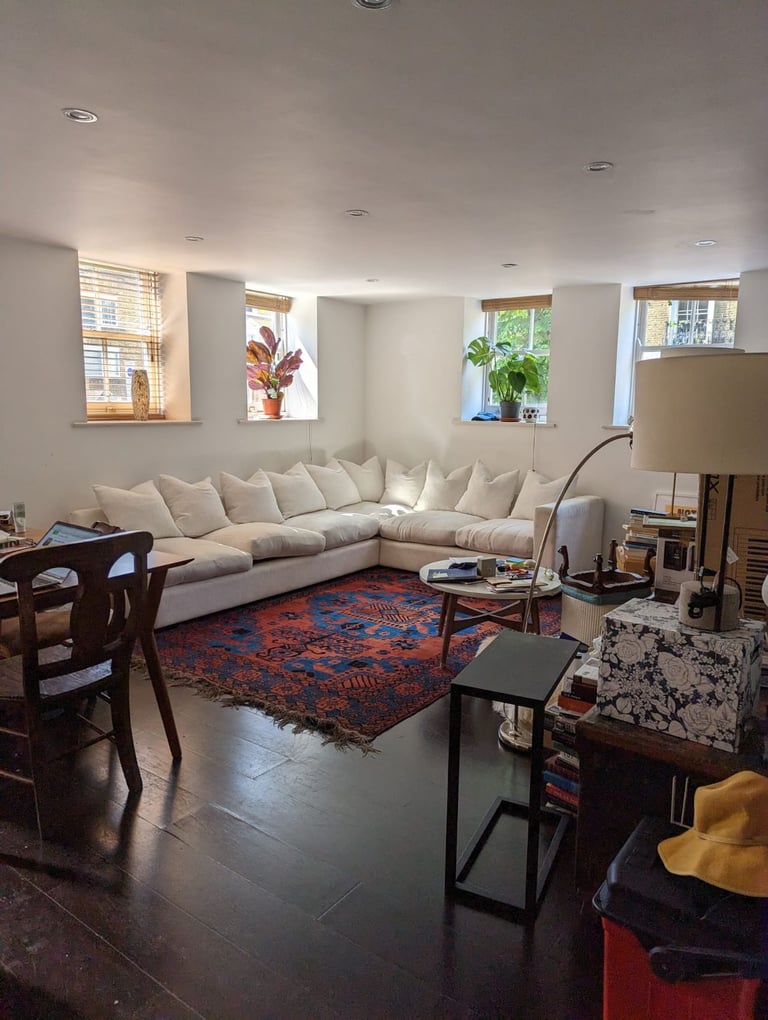 Massive white corner sofa (baby not included)