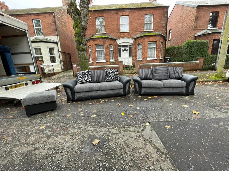 3 and 2 seater sofa in a black land grey fabric and leather couple of wee marks only £245