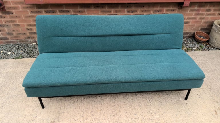image for green 2 seater sofa that folds down to be a sofa bed 