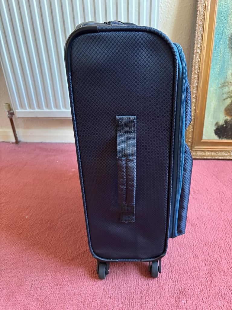 Small suitcase with wheels and extending handle