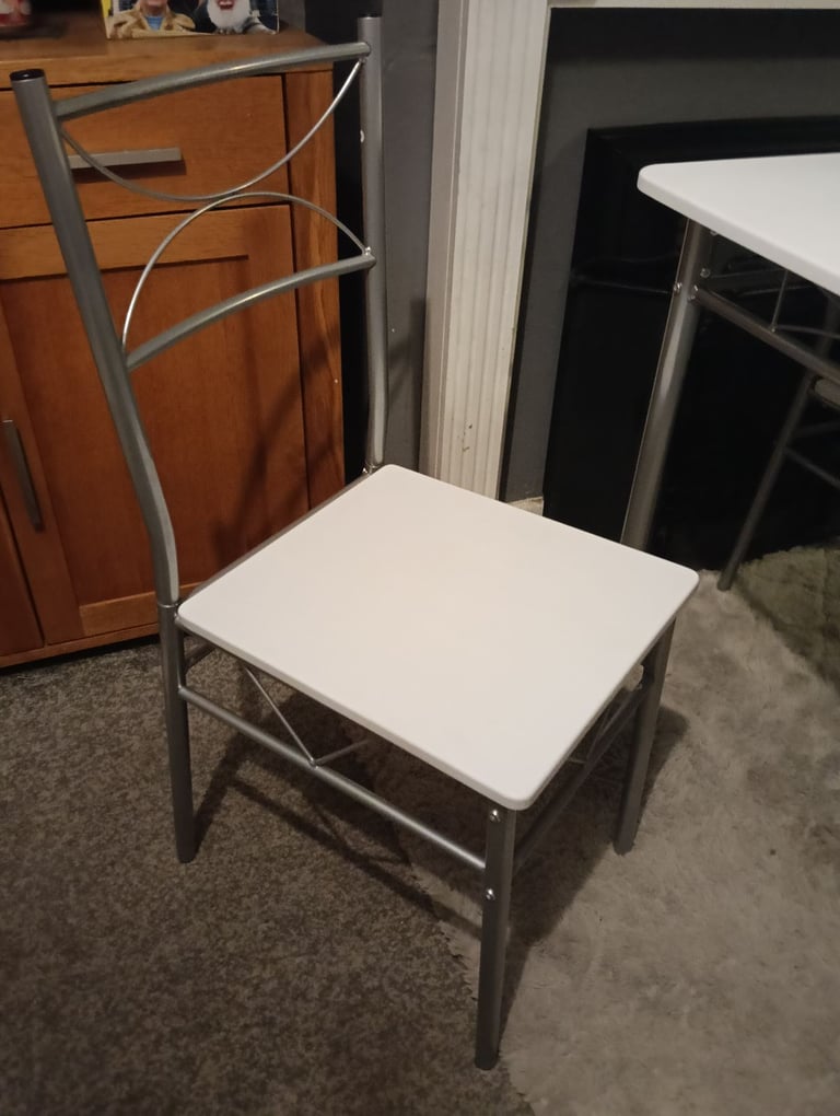 White dining table and four chairs feel free to contact me 
