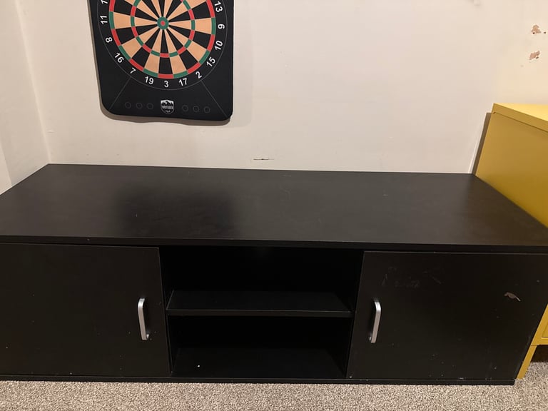 Free under tv cabinet.