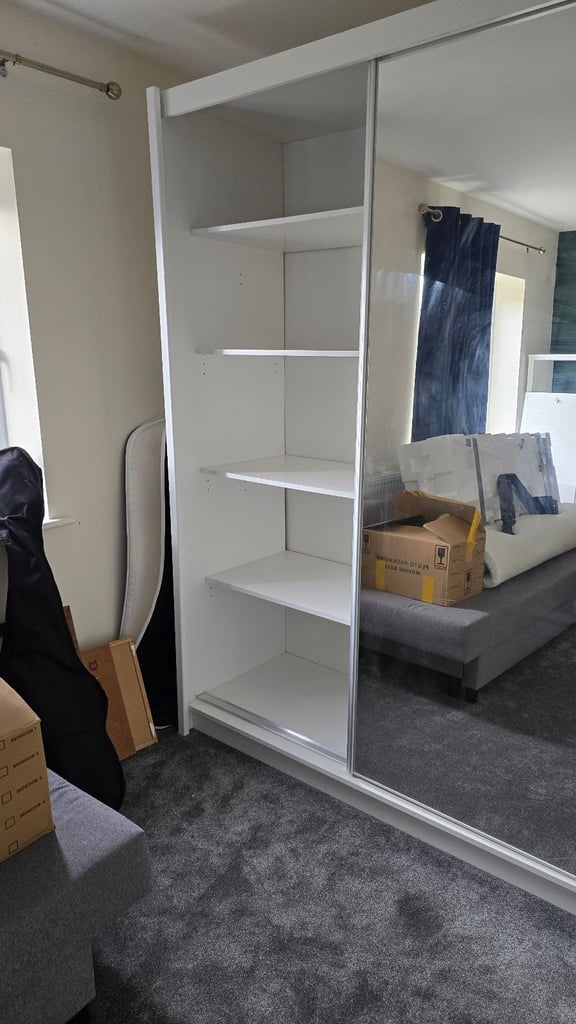 Spacious wardrobe with sliding doors