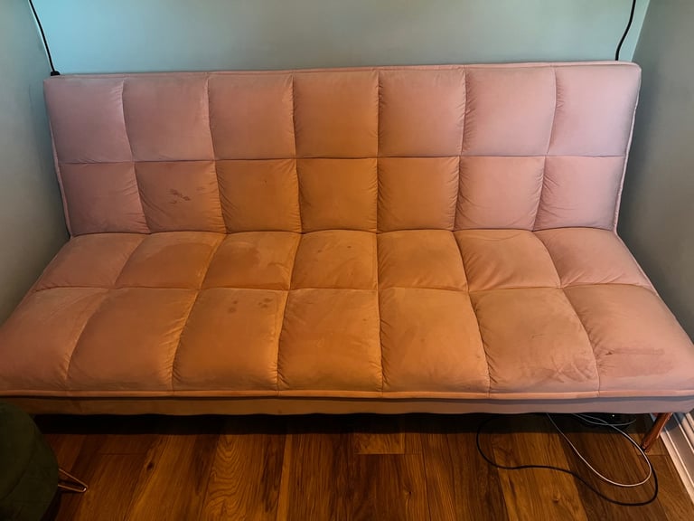 Blush pink velour click clack sofa bed from Made. 