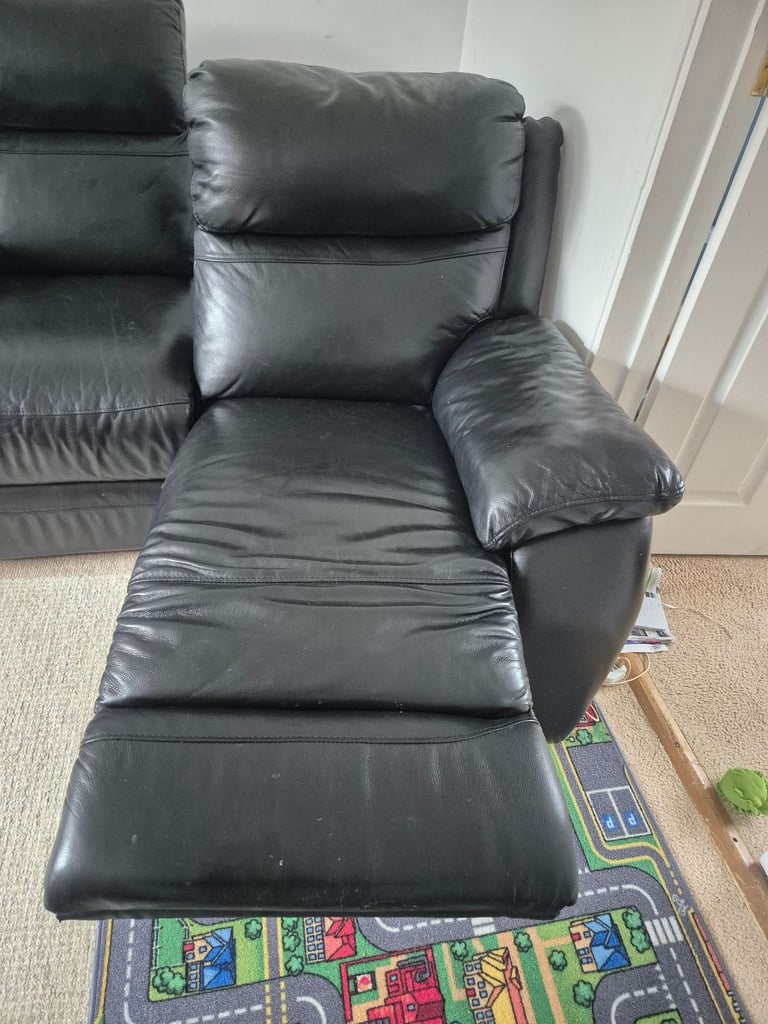 Two seater leather reclining sofa