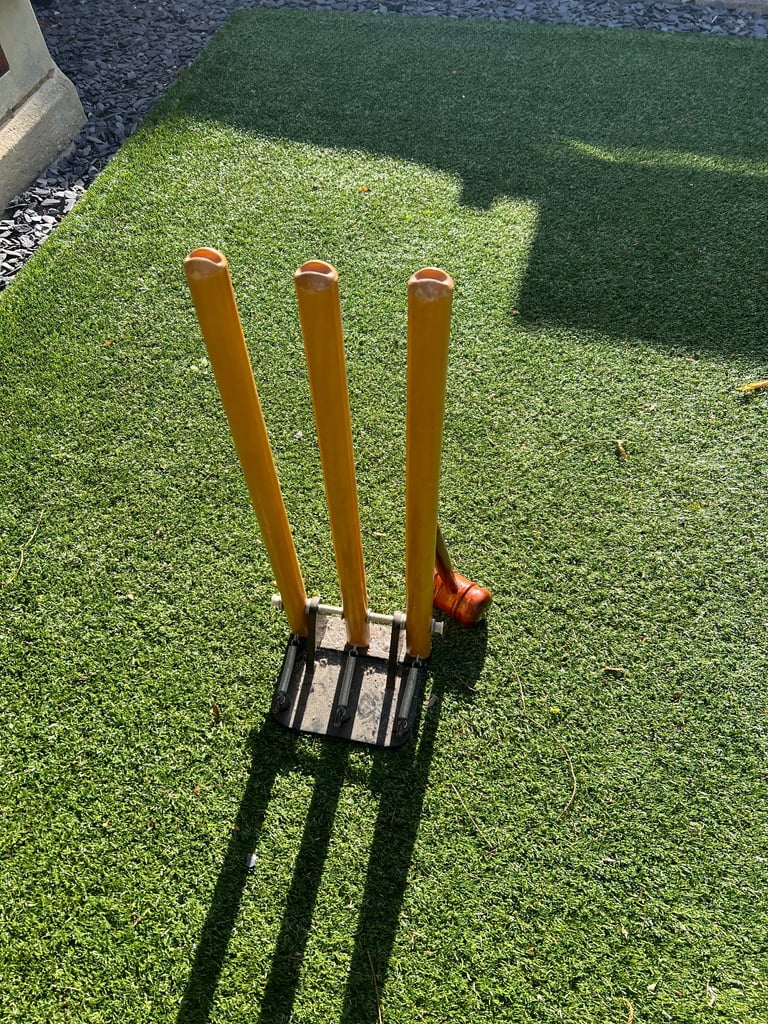 Spring back Kookaburra cricket stumps with cast iron base and a bat mallet