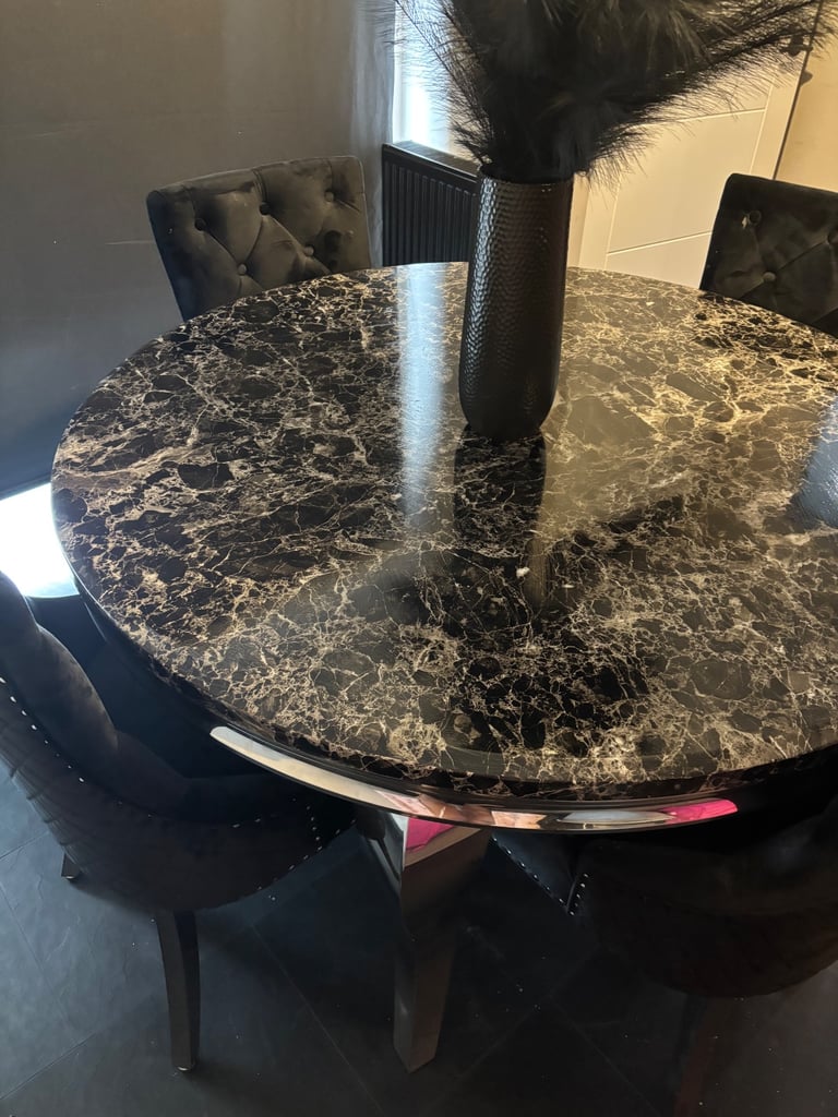 Black marble dinning table and chairs 
