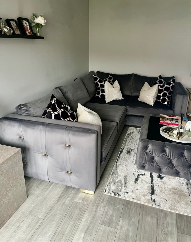 Grey velvet corner sofa and table 