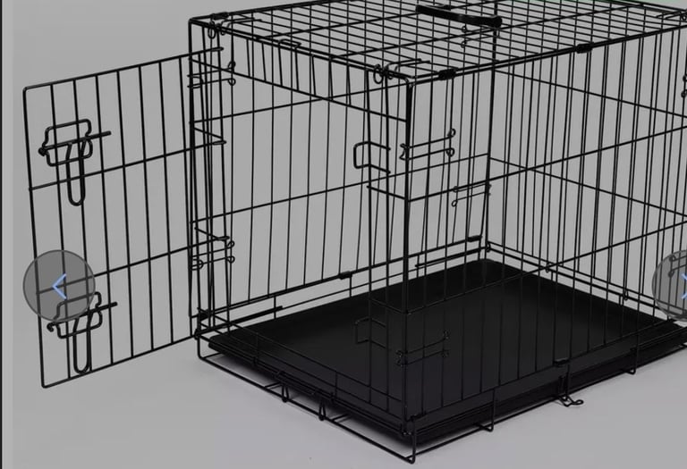 A new still boxed 24 inch Heavy Duty Dog Crate – Black Metal Folding Cage  