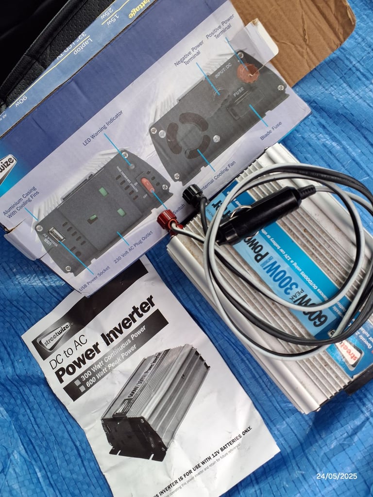 In vehicle 12v DC to 240v AC power unit (300w). 2 x USB ports. 2 sets of cables.