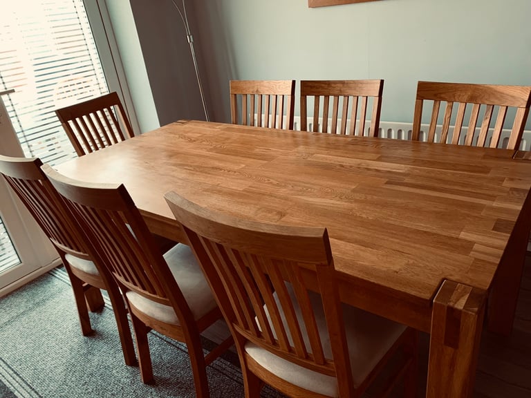 Solid oak dining table and 8 chairs