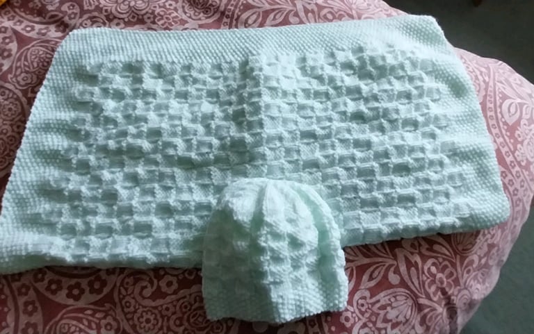 Hand knitted baby blanket and hat