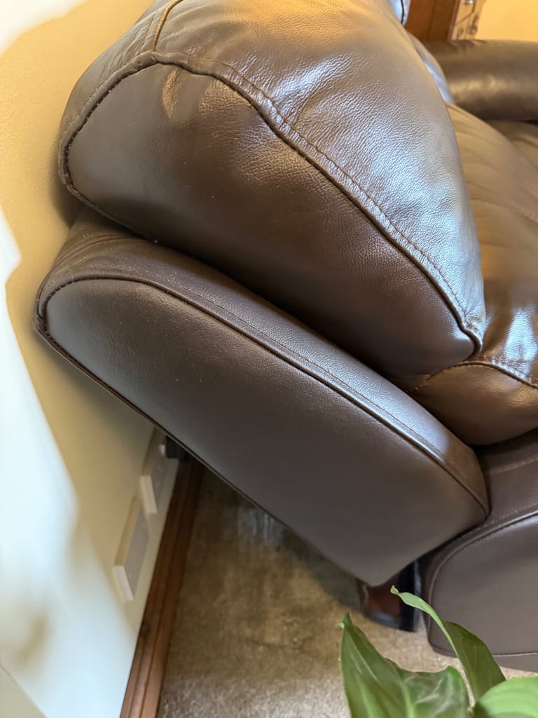 Leather two seater reclining sofa