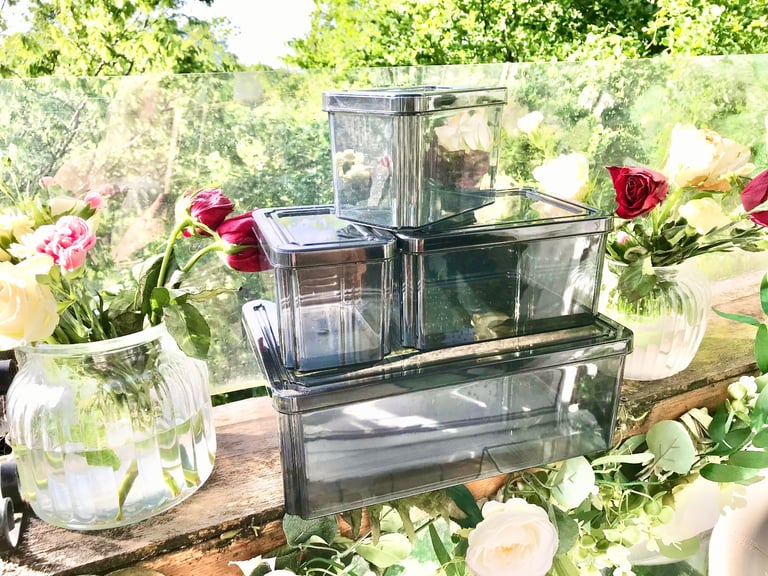 Good quality. Set of 4 Black tint plastic storage boxes Only used a few times