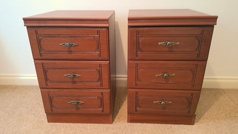 A matching pair of bedside cabinets with 3 drawers in each