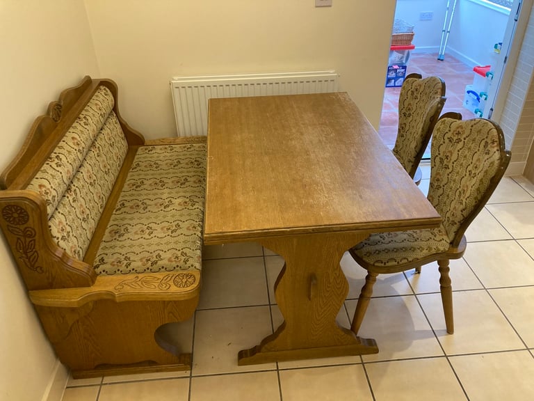 Dining table with chairs and storage bench