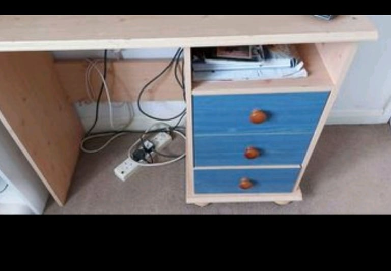 Pine effect and blue drawer desk.