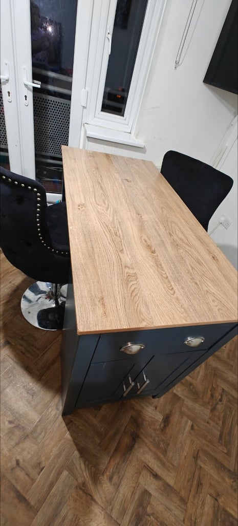 Breakfast bar with two high velvet chairs
