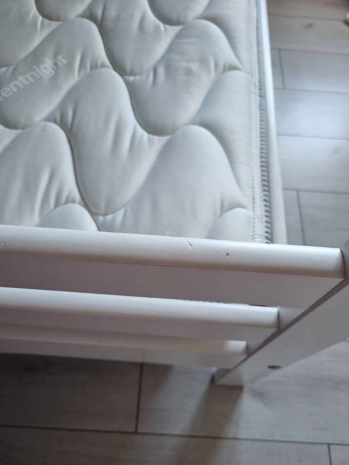 White wooden framed bunk beds with mattresses