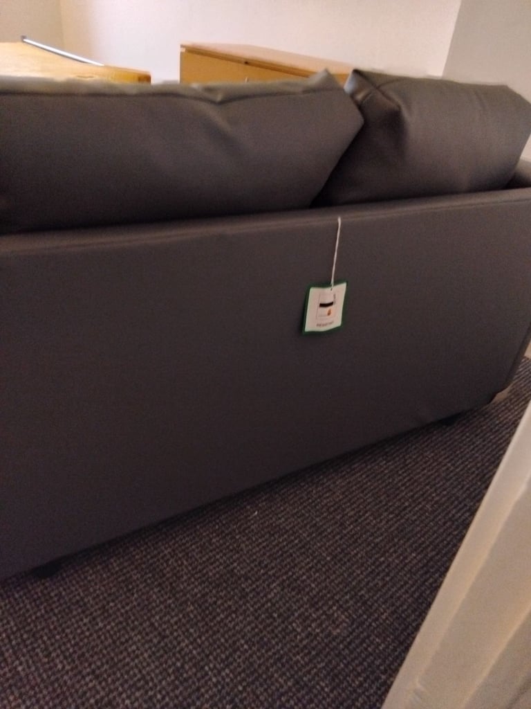 Brand new small 2 seater grey leather couch