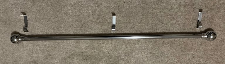 Extendable chrome curtain rail with wall fixings
