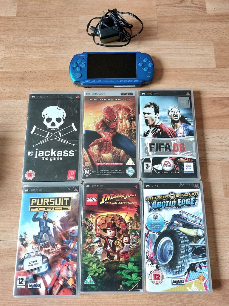 image for Blue Playstation PSP with charger and games 