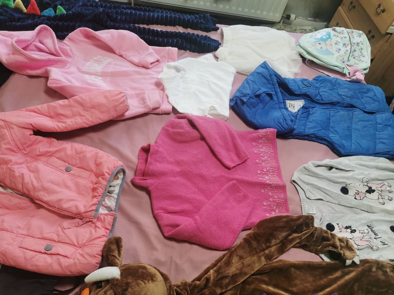 A set of clothes for a 5-6 year old girl. Most of the clothes are in good condition. 