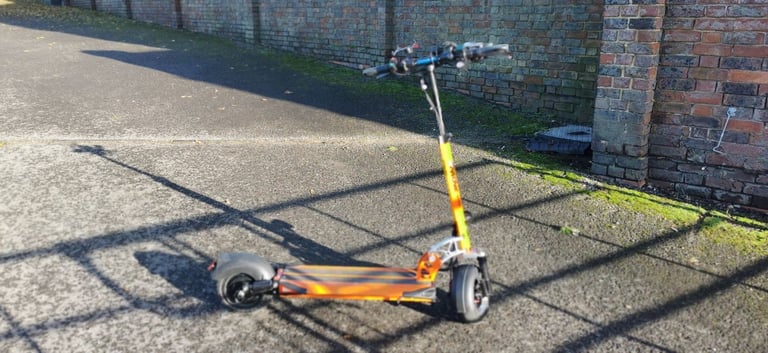 From USA an Orange electric scooter EMOVE Cruiser 'S' 52V 1600W Dual