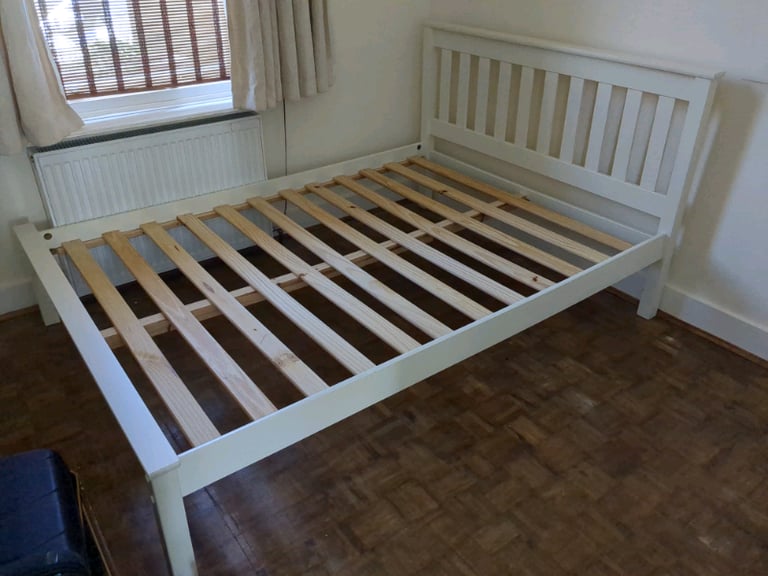 White wooden double bed