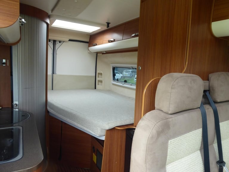 Adria Twin SF. 2013. Rear French Bed. Half dinette hosts 5.