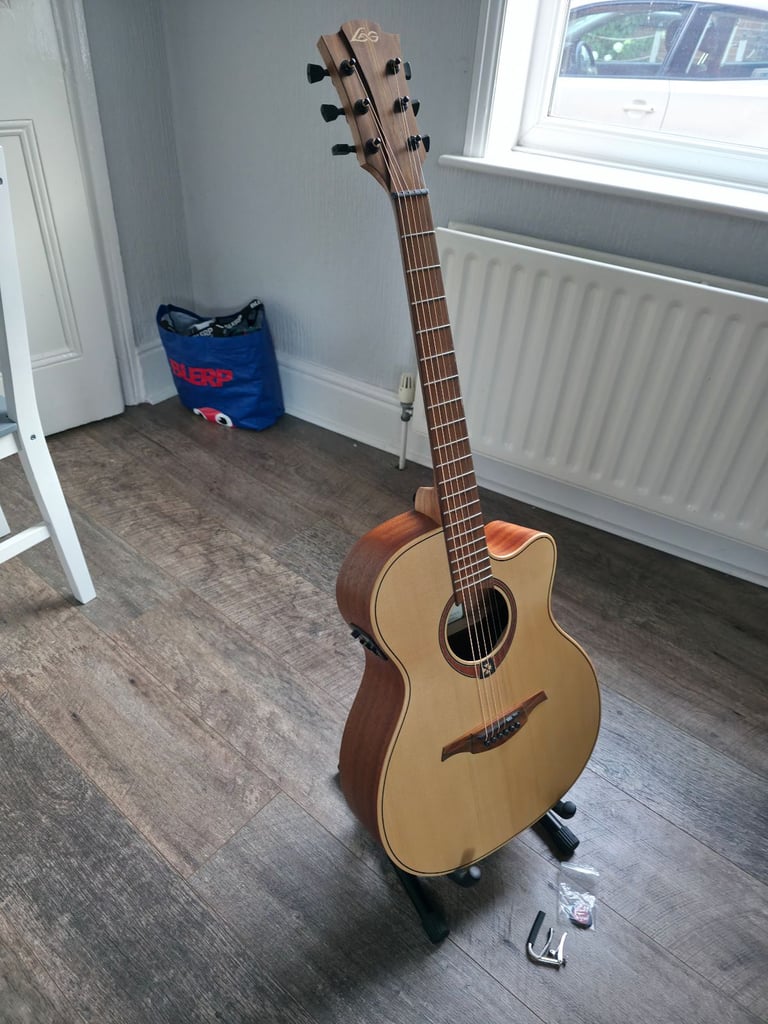 Electro Acoustic Guitar with stand, plectrums, capo included - Barely Used!