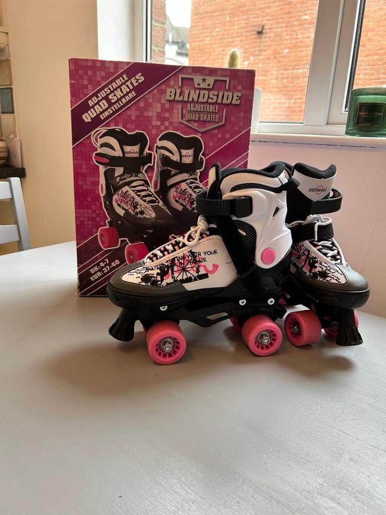 Blindside adjustable quad skates size 4-7 with safety gear.