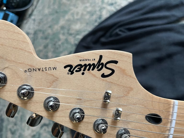 Squier by fender mustang electric guitar in sunburst