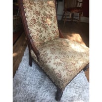 Vintage wooden chair with padded brocade seat and back