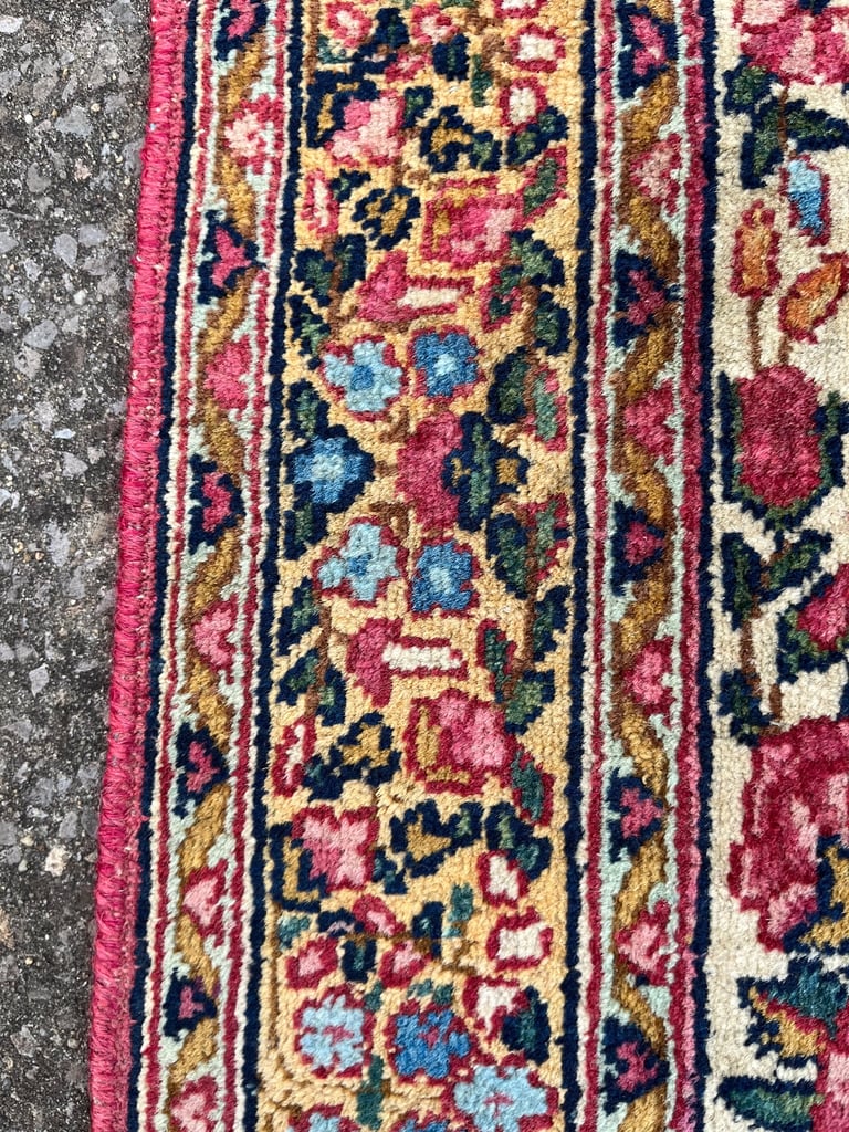 A pair of Antique Kirman mats 
