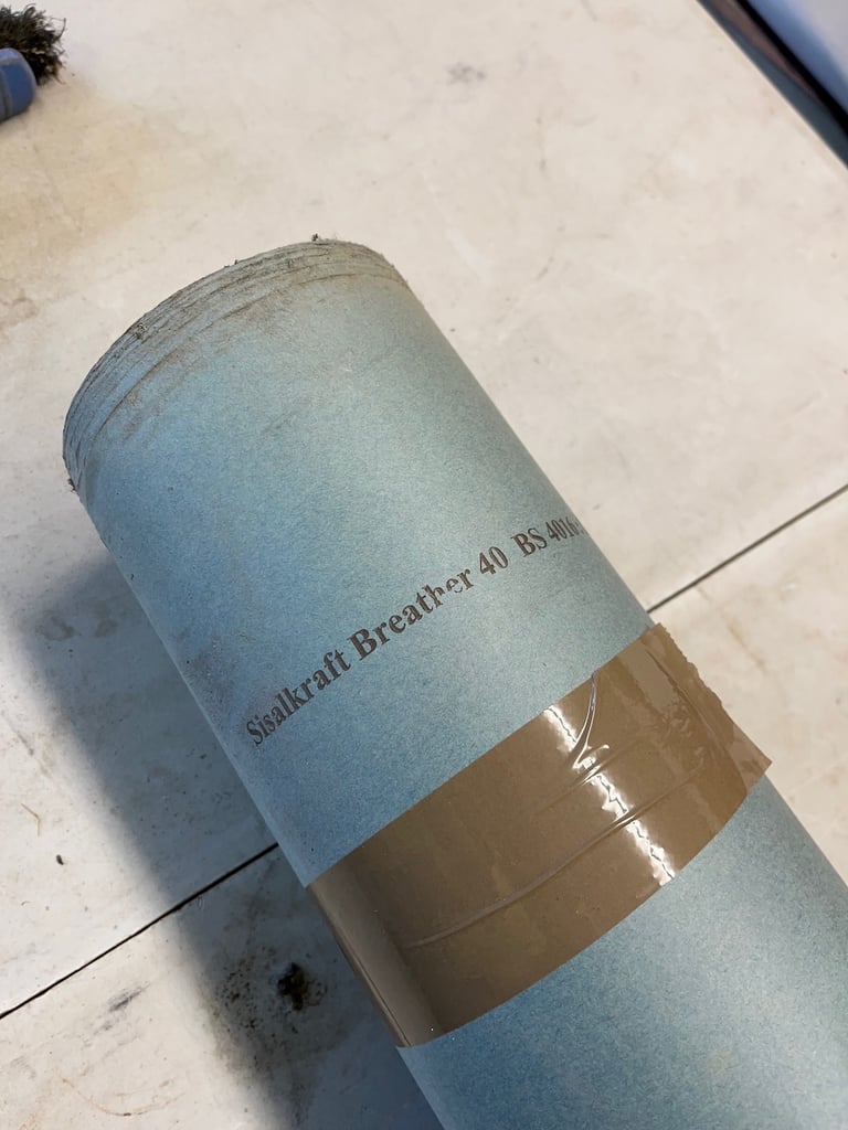 Rolls of building paper and vapour barrier