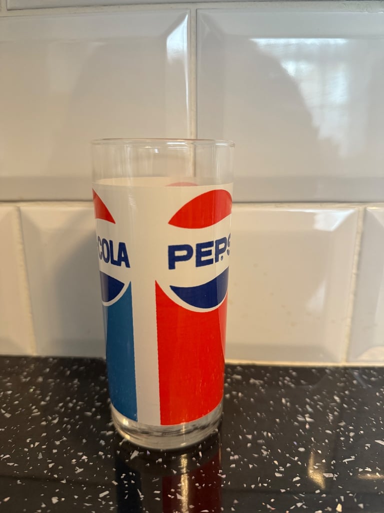 This vintage 1970's Pepsi Cola drinking glass features a striking 3-sided logo in red white & blue