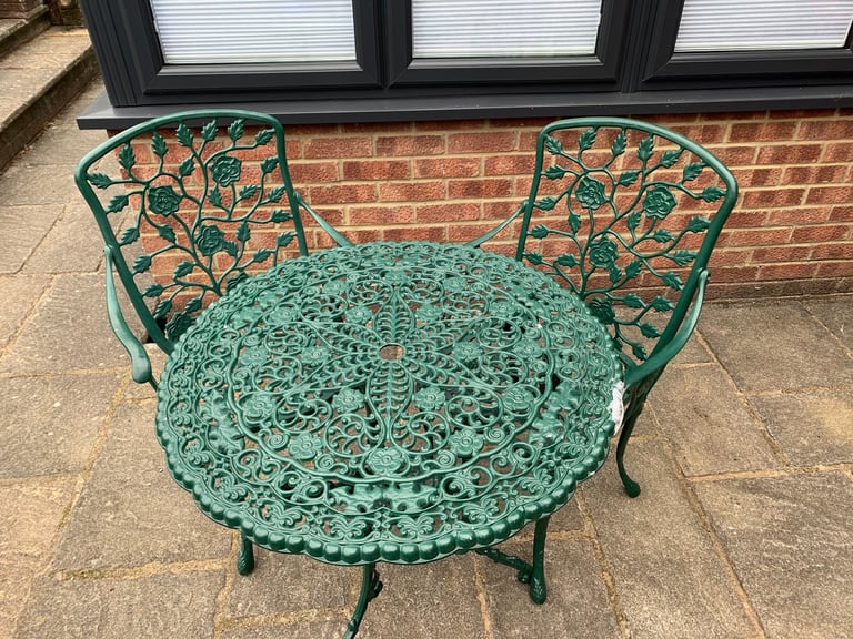 image for Green finish Cast aluminium garden table and 2 chairs in very cool condition. See add for details. 