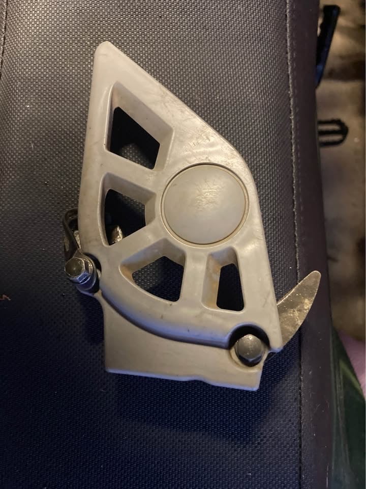 Front sprocket cover from a Suzuki DR 250 may fit other bikes.