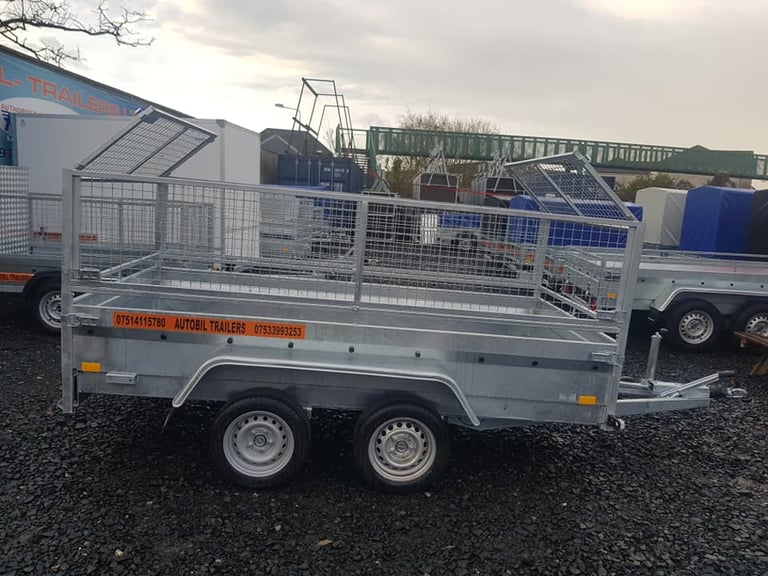 BRAND NEW 10 X 5 MASTER TWIN AXLE HEAVY DUTY TRAILER WITH 60CM MESH AND RAMPS 2700KG