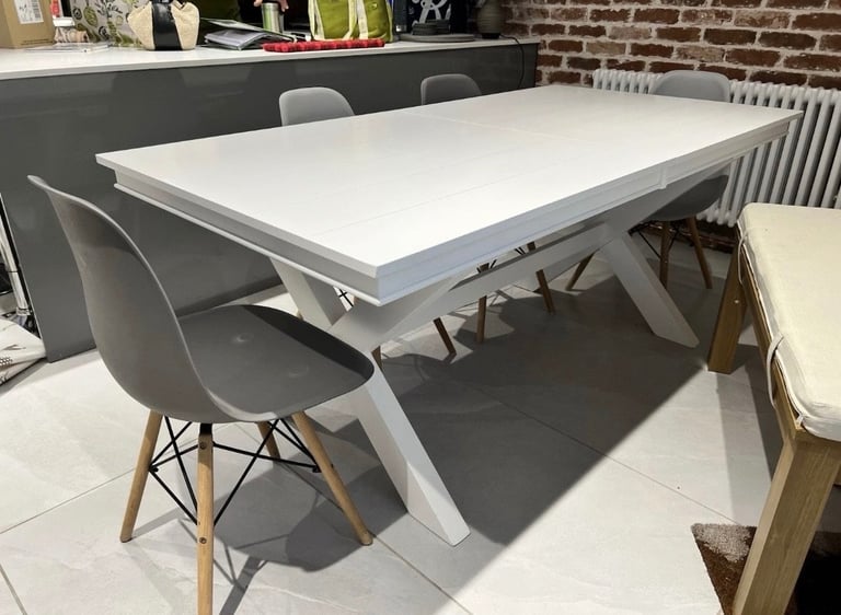 White extendable dining table. Seats up to 10-12