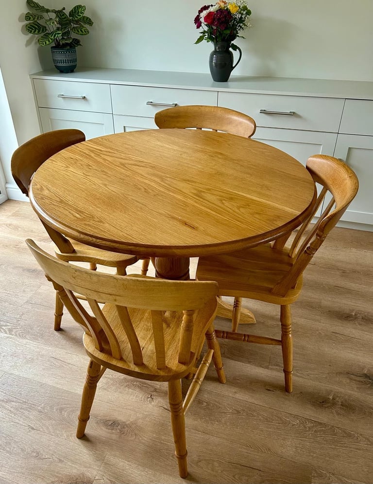 image for Solid oak dining table and four chairs