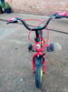 Childs bike with stabilisers  red