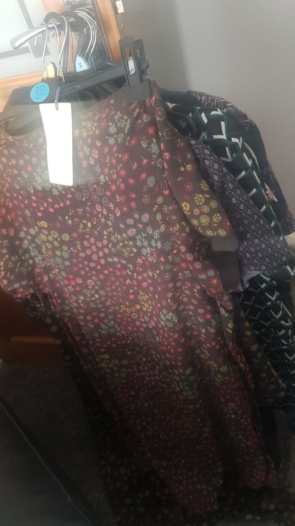 Bag full of women's clothes dresses cardigans scarves shoes sandles 