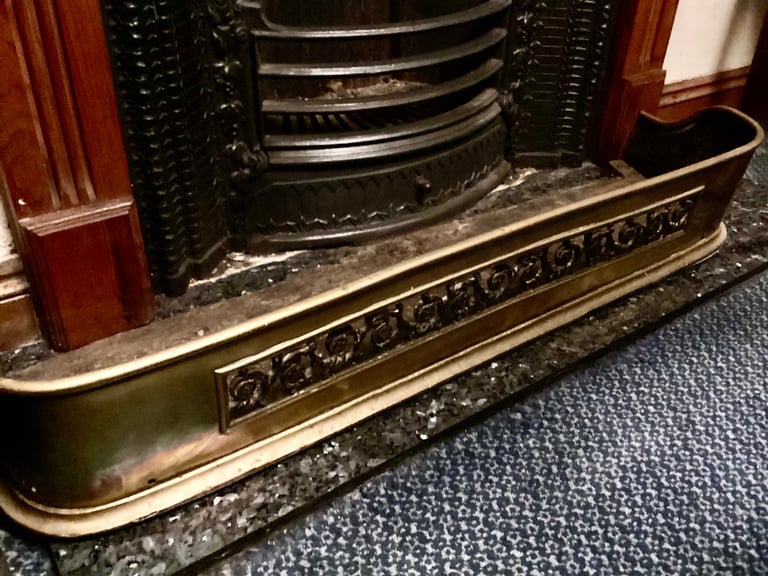 Victorian brass fire fender.