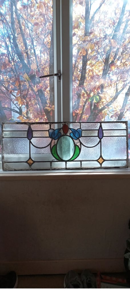 Beautiful coloured stained glass panel .