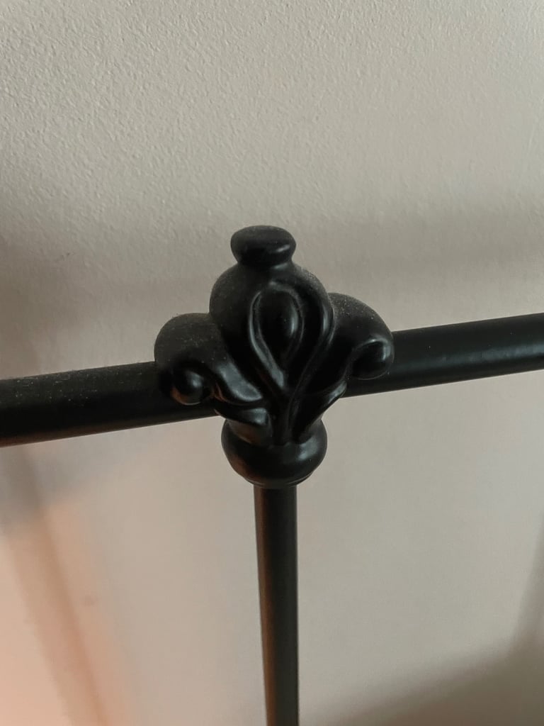 Elegant iron bed frame in vintage style 
