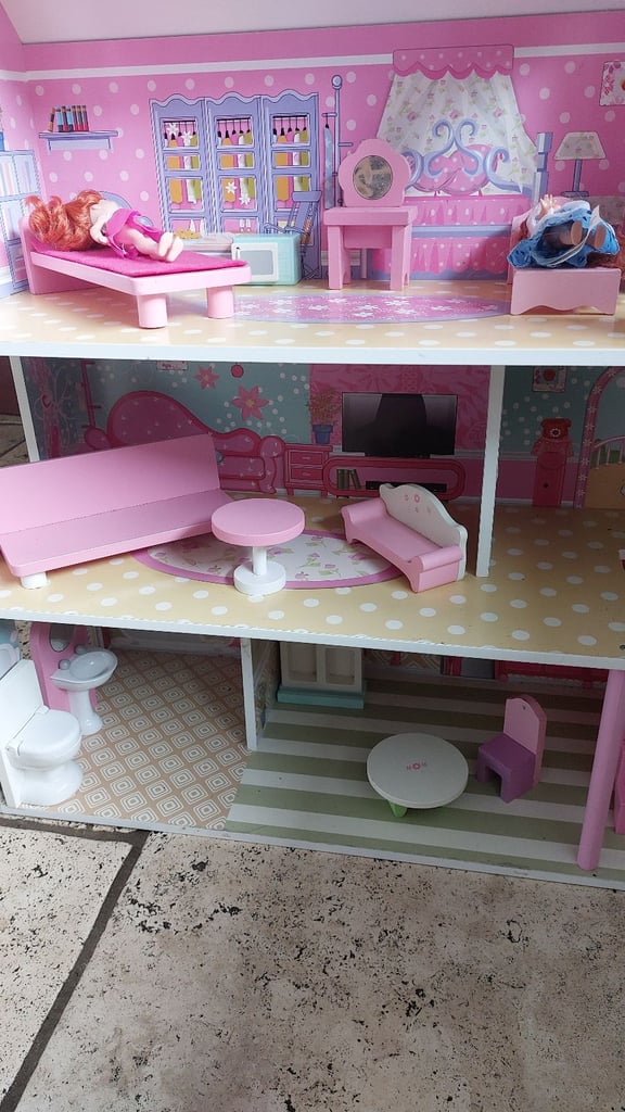 Wooden dolls house with furniture and dolls