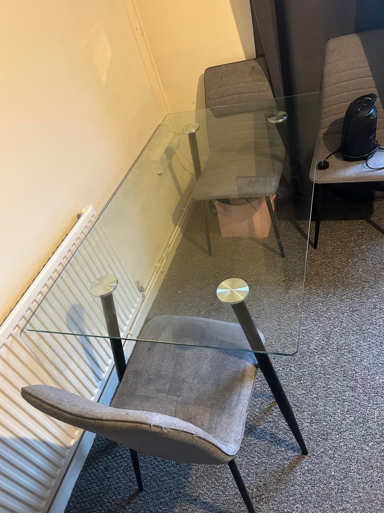 image for Glass table and grey chairs 