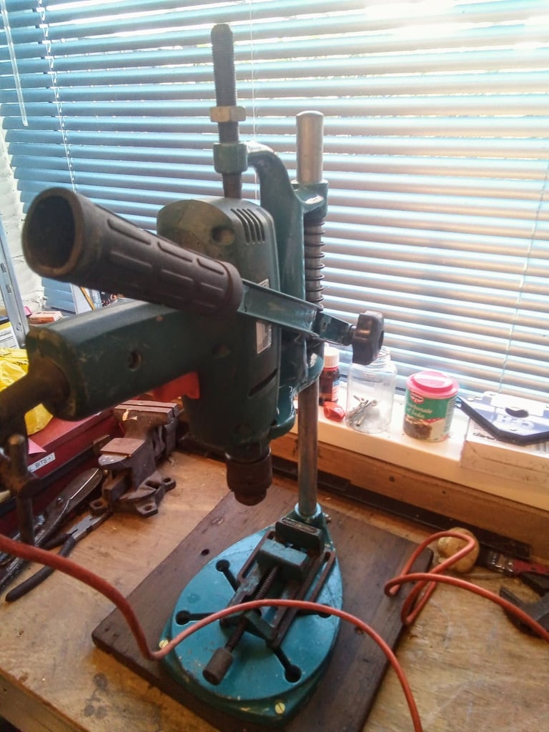 Drill with bench attachment and vice.